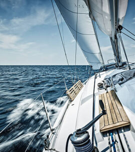 Sailing with sailboat. Long exposure.